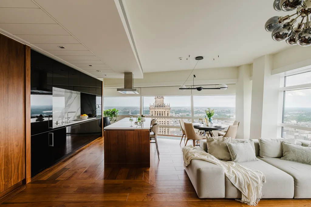 Open kitchen with a walnut island and the living room beyond