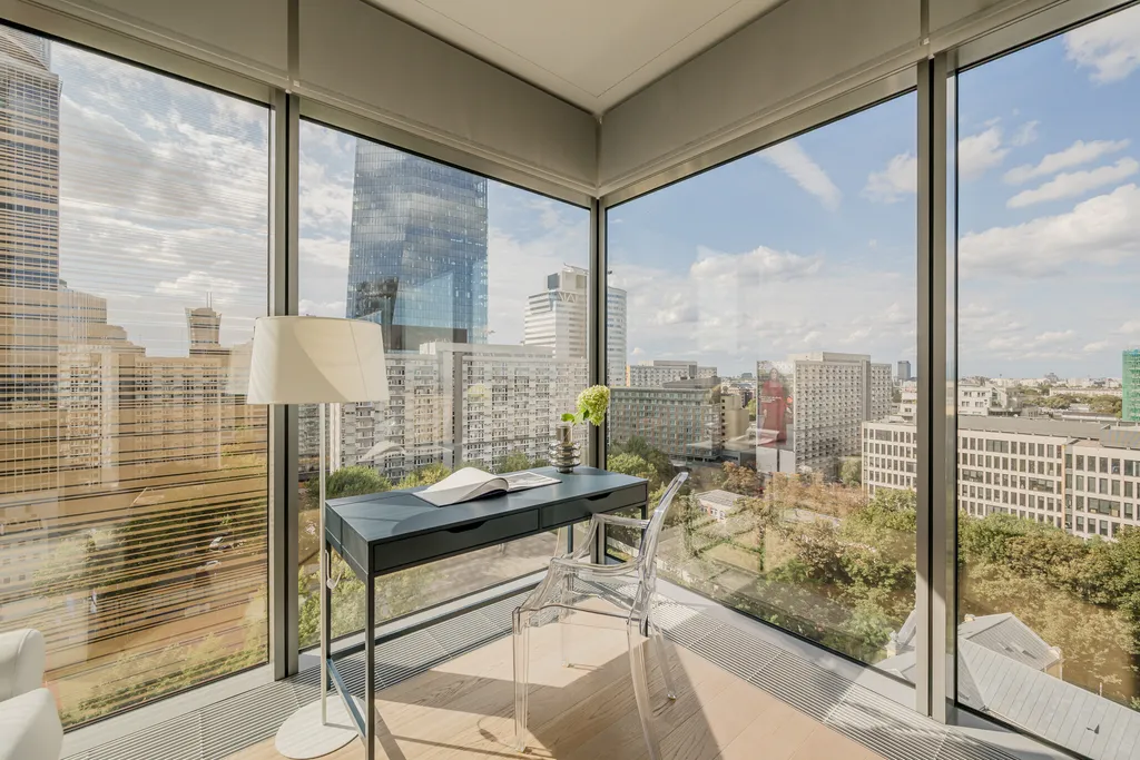 Corner window with a desk and a city view