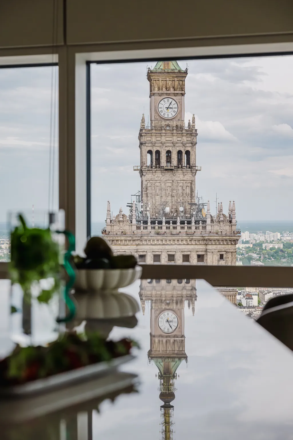 City panorama reflected in a glossy countertop