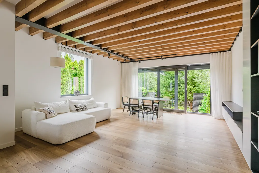 Frame from a house with exposed ceiling beams and marble stairs
