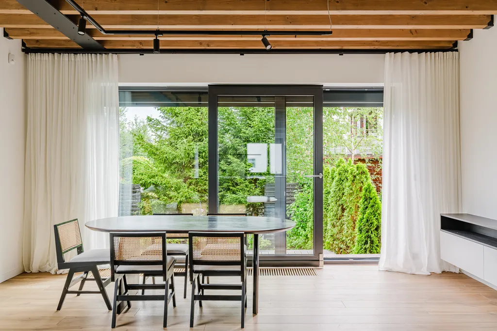 Frame from a house with exposed ceiling beams and marble stairs