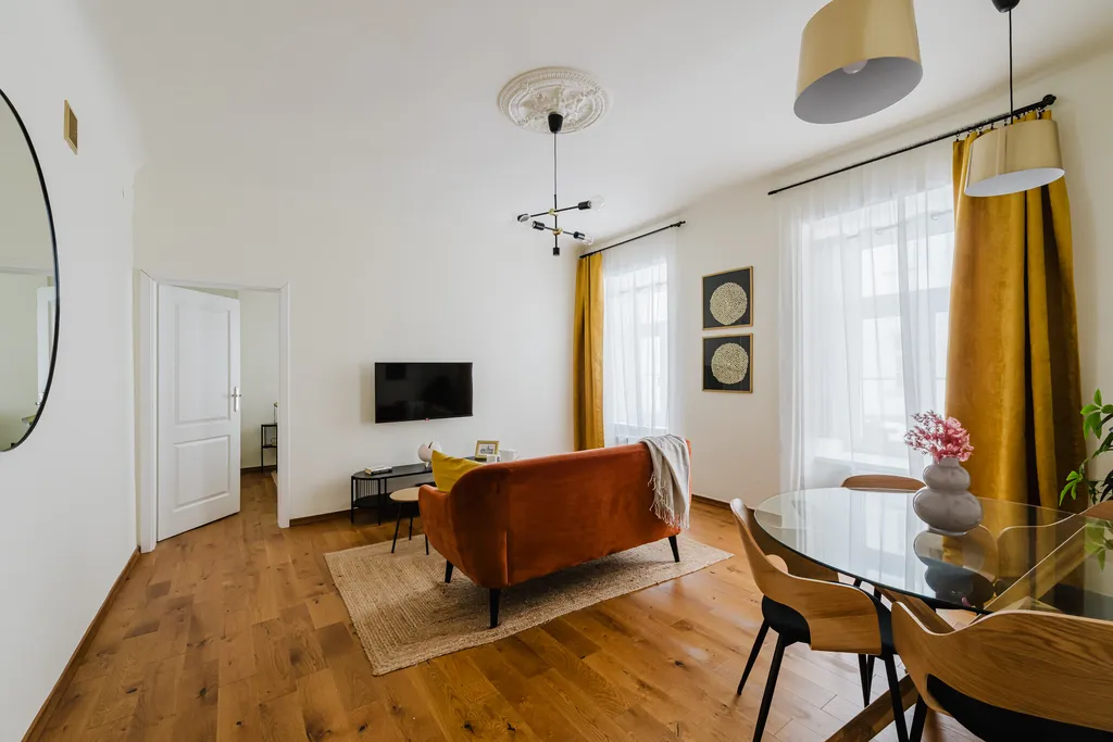 Frame from a pre-war apartment with a rust-coloured sofa