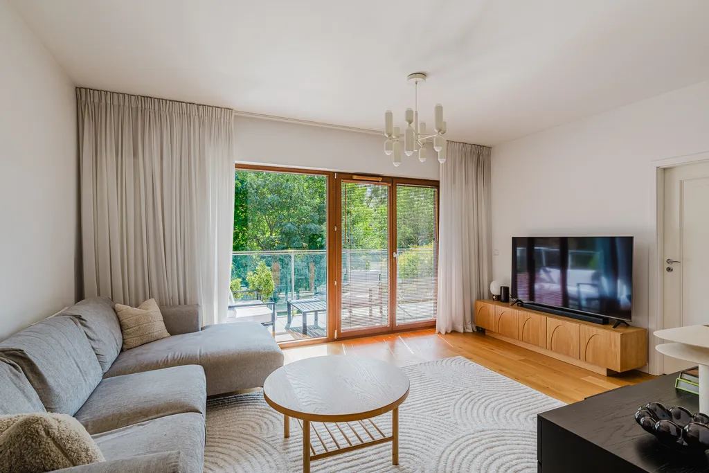 Frame from an apartment with a balcony and large plants
