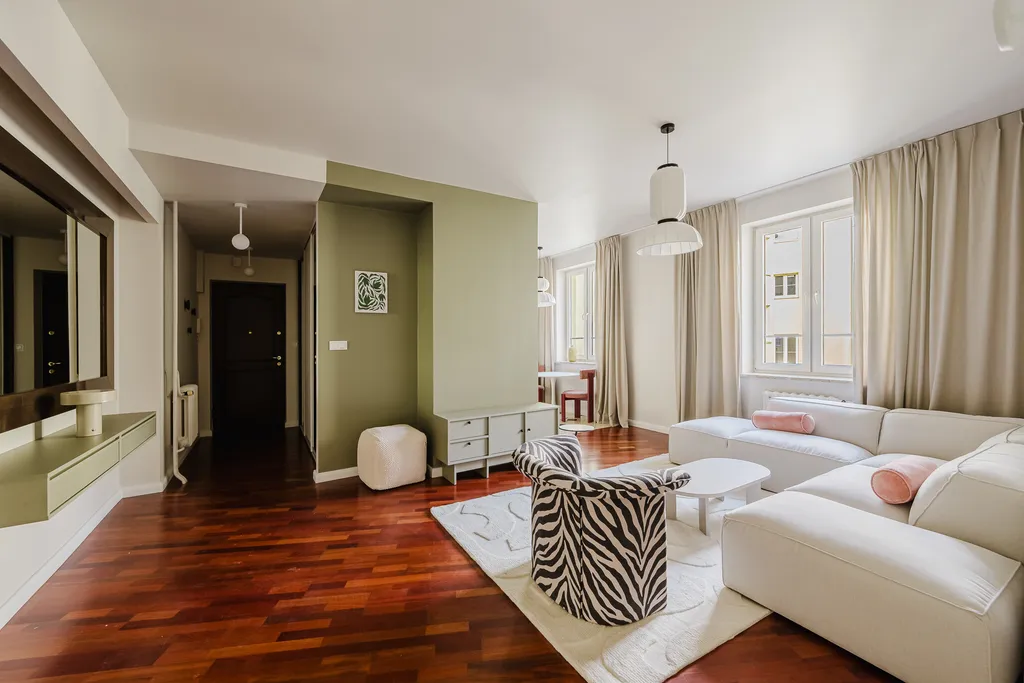 Frame from an apartment in sage tones with parquet