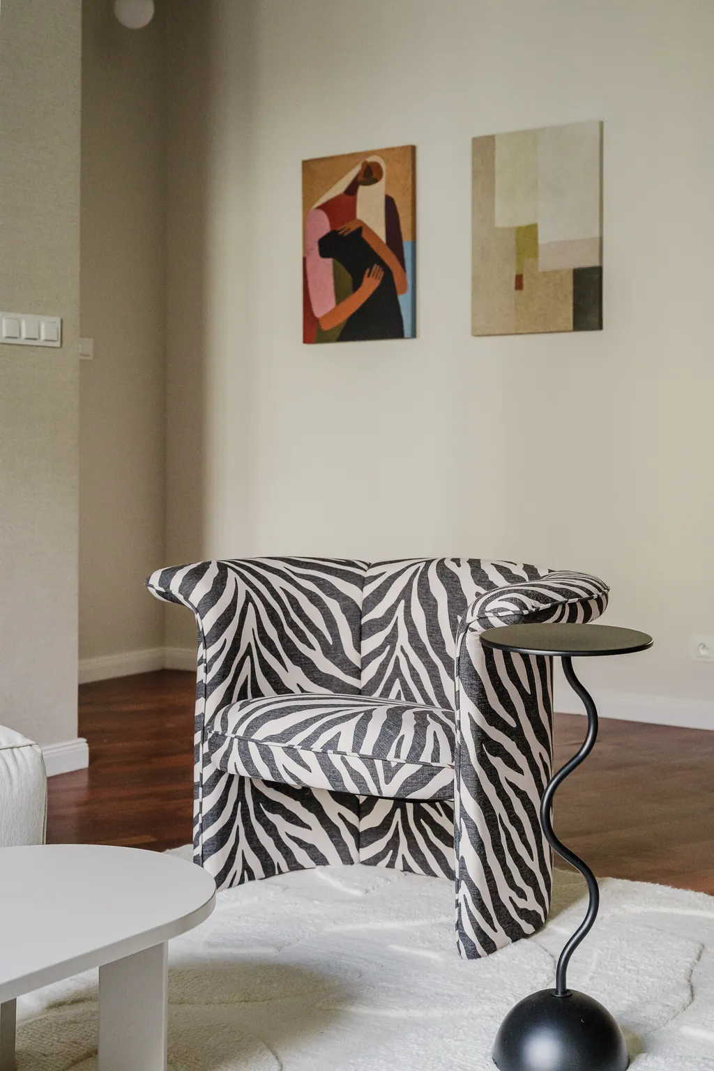 Detail from an apartment in sage tones with parquet