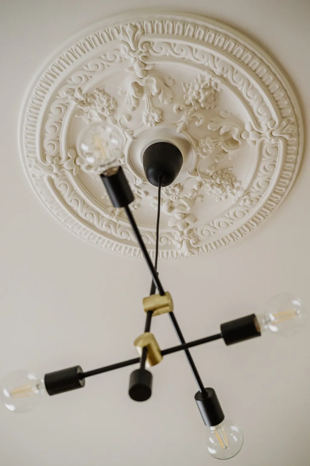 Detail from a pre-war apartment with a rust-coloured sofa
