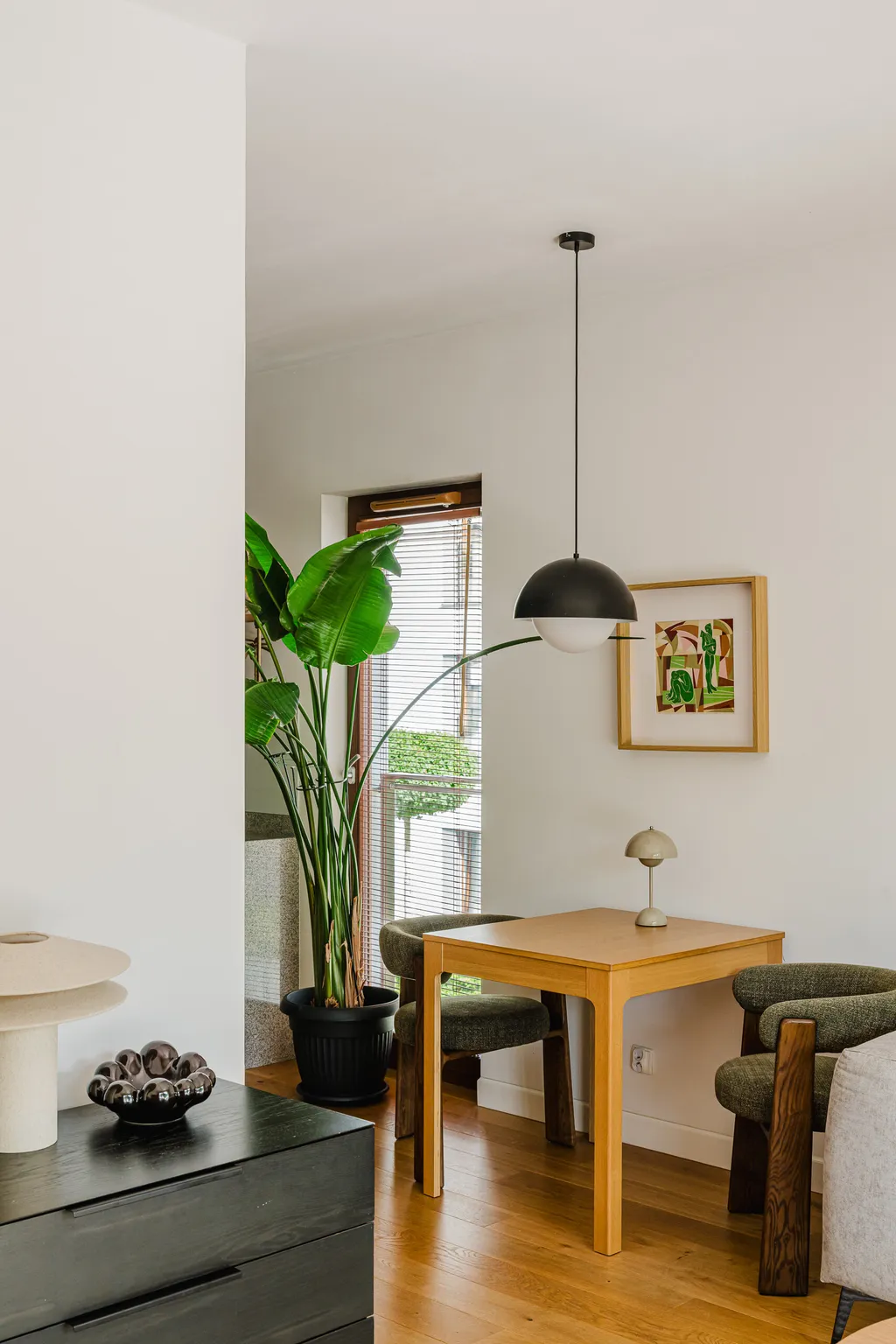 Frame from an apartment with a balcony and large plants