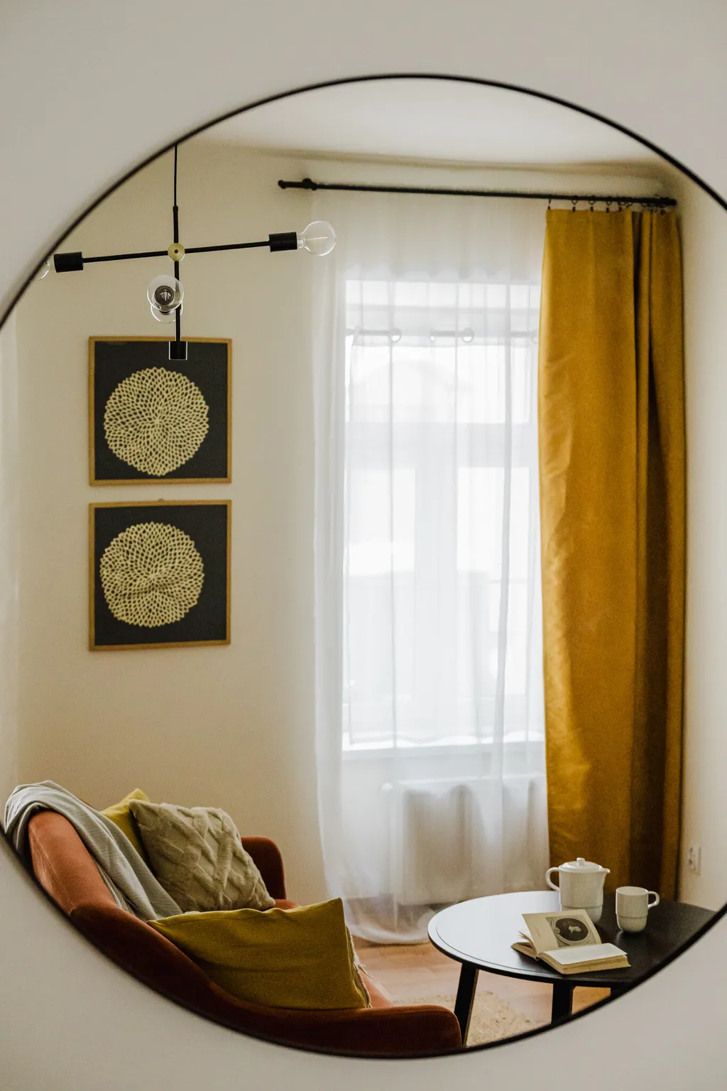Detail from a pre-war apartment with a rust-coloured sofa